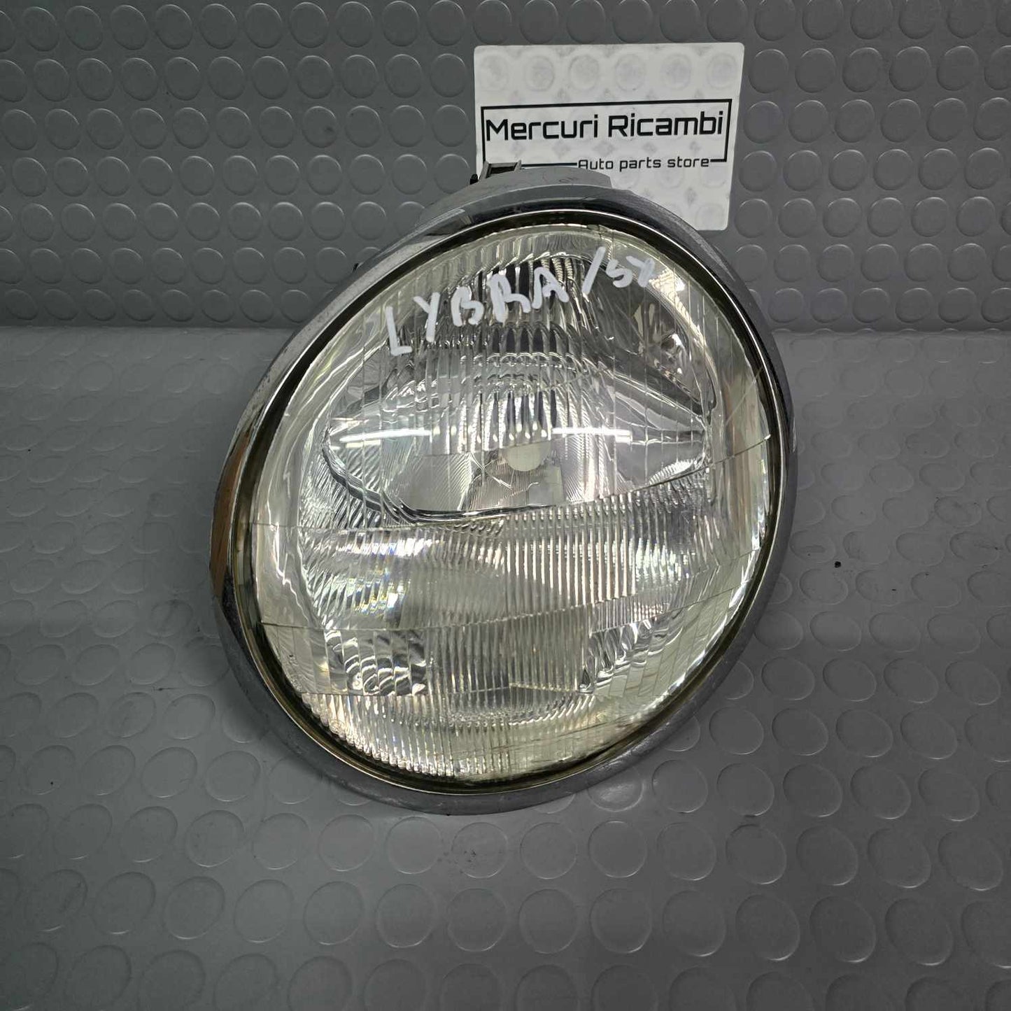 Proiettore sinistro Lancia Lybra